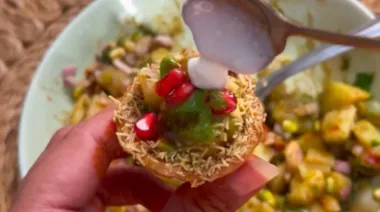 Crispy fried chaat cones filled with potato-moong stuffing, chutneys, curd and sev